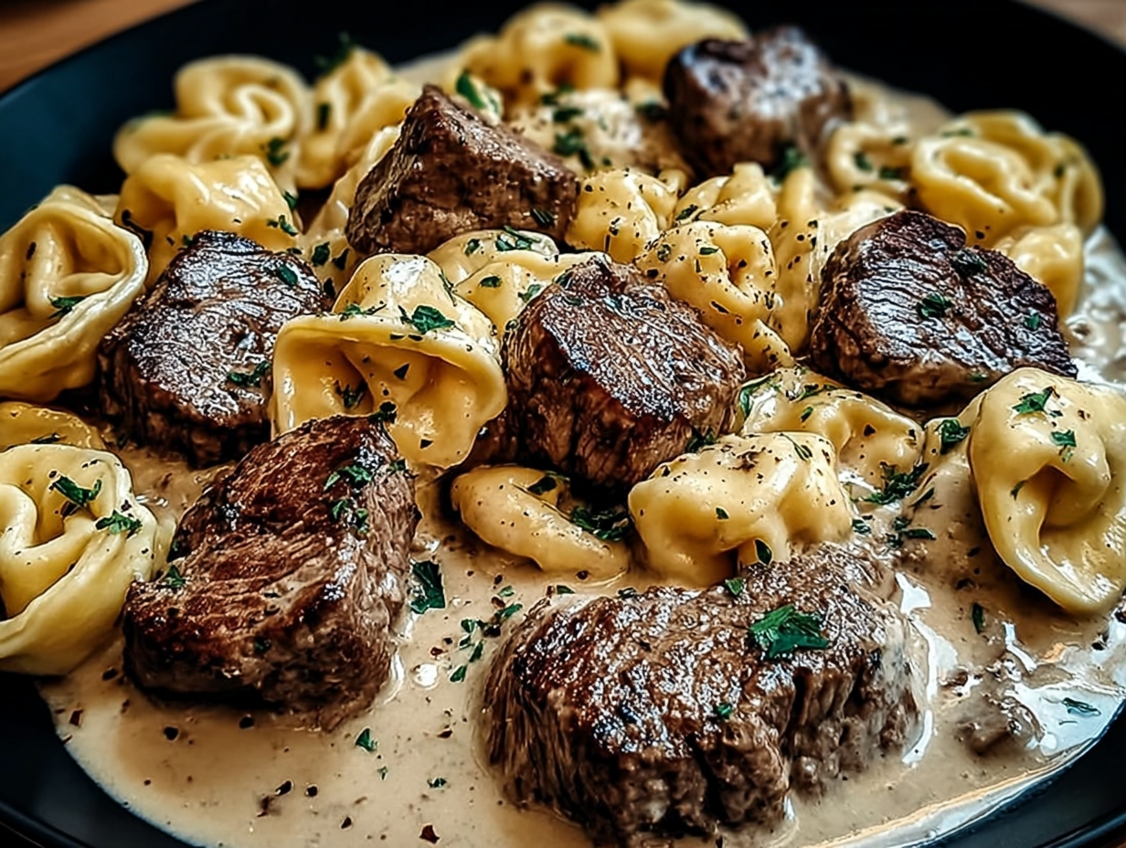 Garlic Steak Tortellini in a white bowl